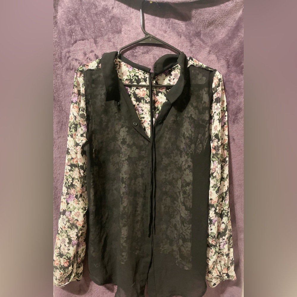 Sheer button down shirt with floral pattern.